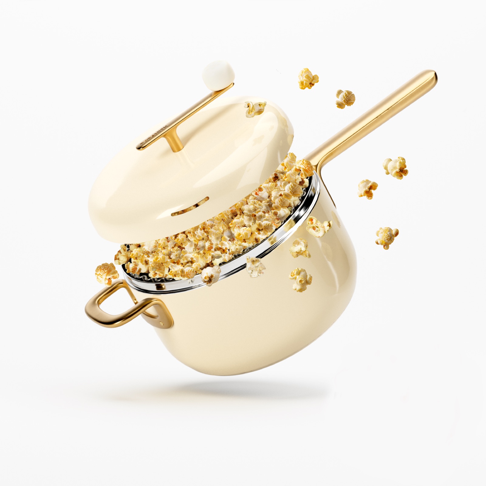 Gold-handled Popsmith stainless steel stovetop popper with freshly popped popcorn